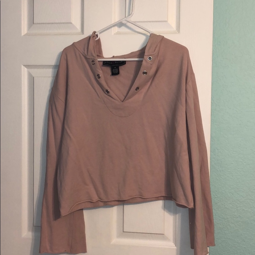 pink sweatshirt, sleeves flare out